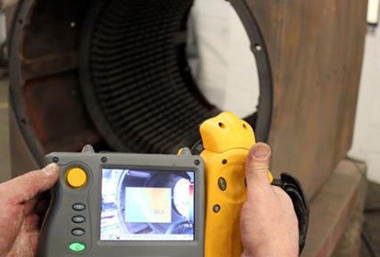 Testing a repaired DC motor to ensure a completed rewind.