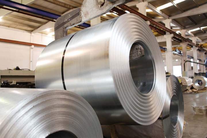 Industrial rolls of steel packaged for shipping.